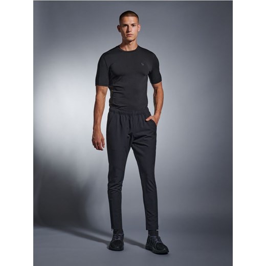 Sinsay - Spodnie dresowe SNSY PERFORMANCE - czarny ze sklepu Sinsay w kategorii Spodnie męskie - zdjęcie 162521601