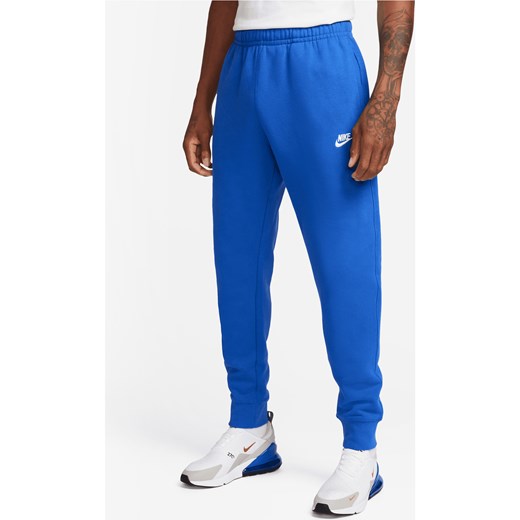 Joggery Nike Sportswear Club Fleece - Niebieski ze sklepu Nike poland w kategorii Spodnie męskie - zdjęcie 163614792