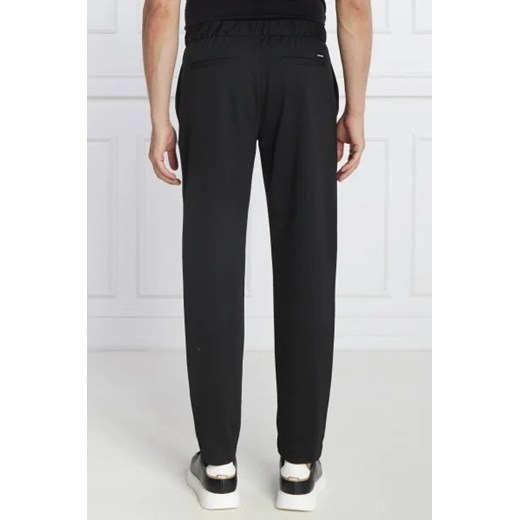 Calvin Klein Spodnie dresowe COMFORT KNIT PLEAT | Tapered fit Calvin Klein S okazja Gomez Fashion Store