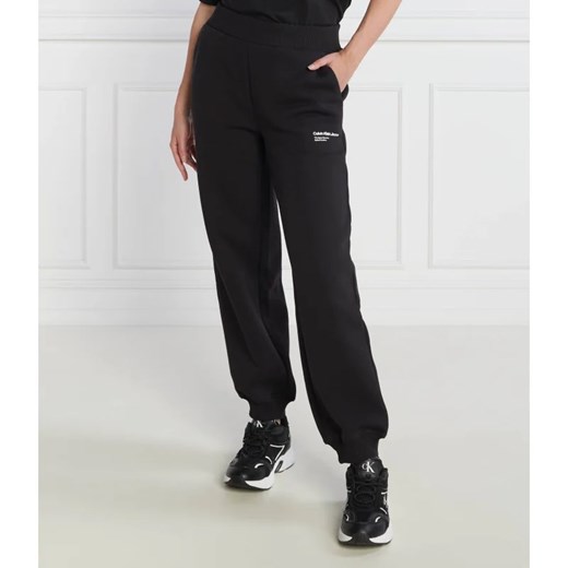 CALVIN KLEIN JEANS Spodnie dresowe GALAXY PRINT | Comfort fit ze sklepu Gomez Fashion Store w kategorii Spodnie damskie - zdjęcie 164328910