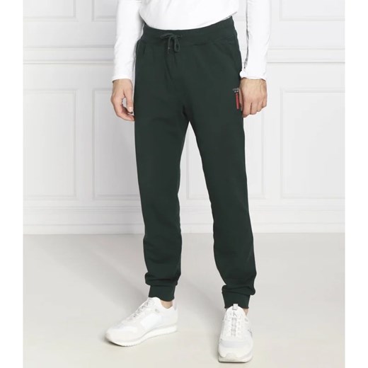 GUESS Spodnie dresowe Adam | Regular Fit ze sklepu Gomez Fashion Store w kategorii Spodnie męskie - zdjęcie 164330353