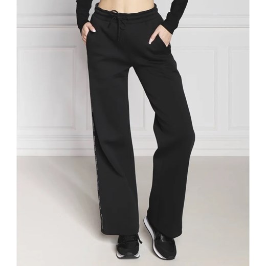 CALVIN KLEIN JEANS Spodnie dresowe LOGO PIPING | flare fit L wyprzedaż Gomez Fashion Store