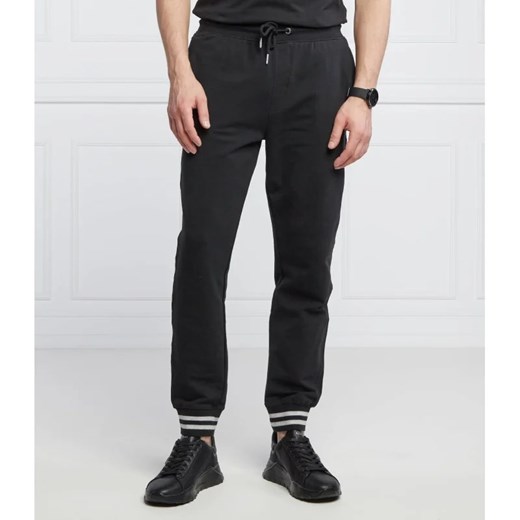 GUESS Spodnie dresowe Adam | Relaxed fit ze sklepu Gomez Fashion Store w kategorii Spodnie męskie - zdjęcie 164335730
