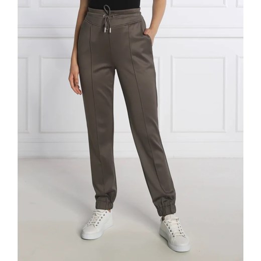 GUESS Spodnie dresowe ARMELLE | Regular Fit ze sklepu Gomez Fashion Store w kategorii Spodnie damskie - zdjęcie 164337442
