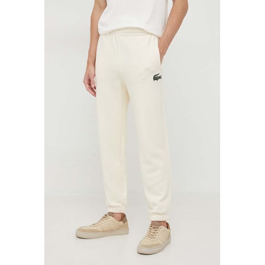 Lacoste spodnie dresowe bawełniane kolor beżowy gładkie Lacoste XS PRM