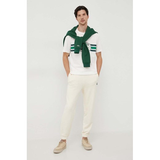 Lacoste spodnie dresowe bawełniane kolor beżowy gładkie Lacoste S PRM