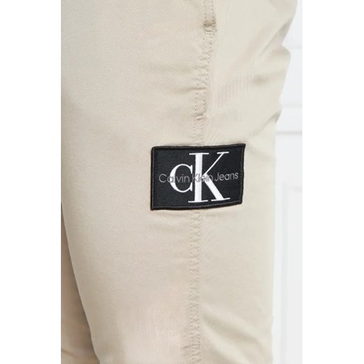 Spodnie męskie beżowe Calvin Klein z elastanu jesienne 