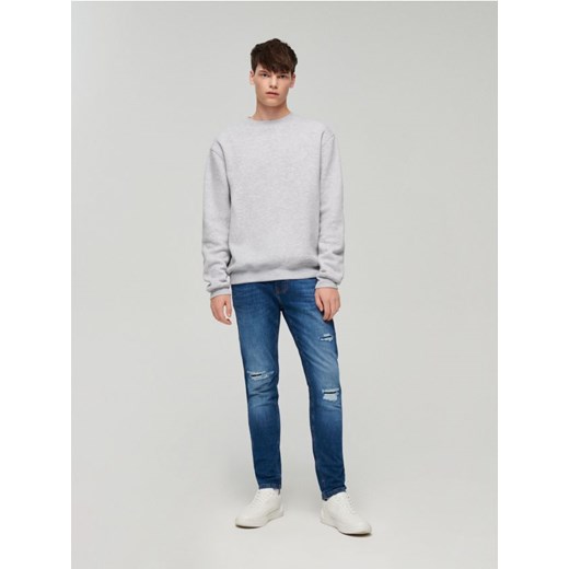 Jeansy slim fit z dziurami niebieskie House 28/30 House