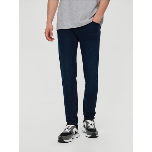 Ciemnogranatowe spodnie jeansowe slim fit House 31/32 House