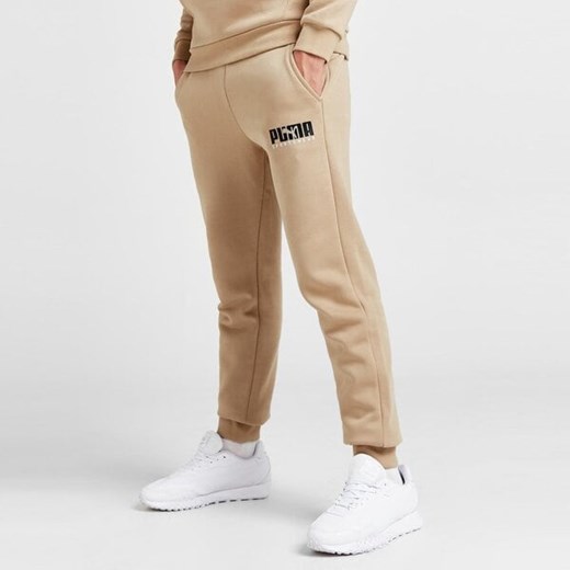 PUMA SPODNIE KEY GRAPHIC PANTS FL ze sklepu JD Sports  w kategorii Spodnie męskie - zdjęcie 166467420
