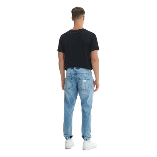 Cropp - Niebieskie jeansy jogger z przetarciami - niebieski Cropp 28/30 Cropp