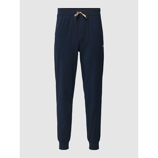 Spodnie dresowe o kroju regular fit z elastycznym pasem i tunelem ze sklepu Peek&Cloppenburg  w kategorii Spodnie męskie - zdjęcie 167697721