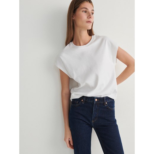 Granatowe jeansy damskie Reserved