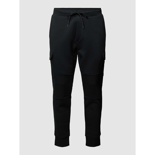 Spodnie dresowe z detalem z logo w jednolitym kolorze ze sklepu Peek&Cloppenburg  w kategorii Spodnie męskie - zdjęcie 167935301