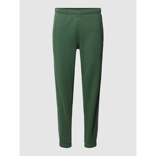 Spodnie dresowe z paskami z logo model ‘TAPE’ ze sklepu Peek&Cloppenburg  w kategorii Spodnie męskie - zdjęcie 168294692