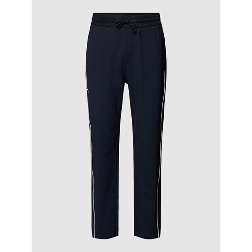 Spodnie dresowe z wypustkami w kontrastowym kolorze model ‘Lamont’ ze sklepu Peek&Cloppenburg  w kategorii Spodnie męskie - zdjęcie 168308390