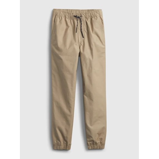 Gap Spodnie materiałowe 707988-03 Beżowy Regular Fit ze sklepu MODIVO w kategorii Spodnie chłopięce - zdjęcie 168383444