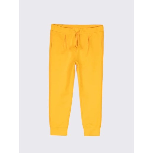Coccodrillo Spodnie dresowe WC2120101WIL Żółty Regular Fit ze sklepu MODIVO w kategorii Spodnie dziewczęce - zdjęcie 168407533