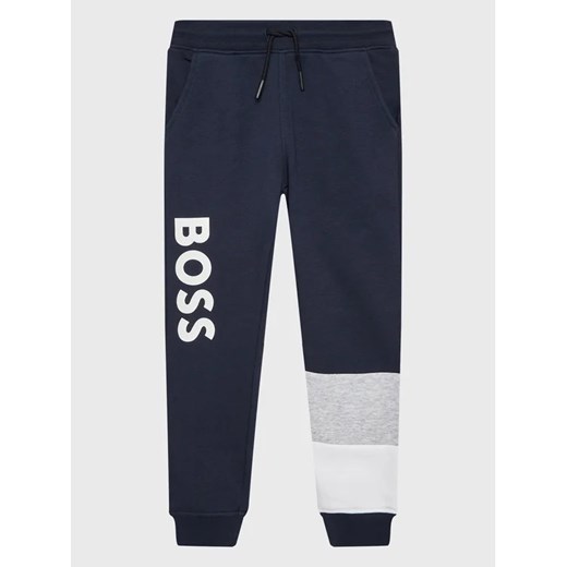 Boss Spodnie dresowe J24828 S Granatowy Regular Fit ze sklepu MODIVO w kategorii Spodnie chłopięce - zdjęcie 168416860