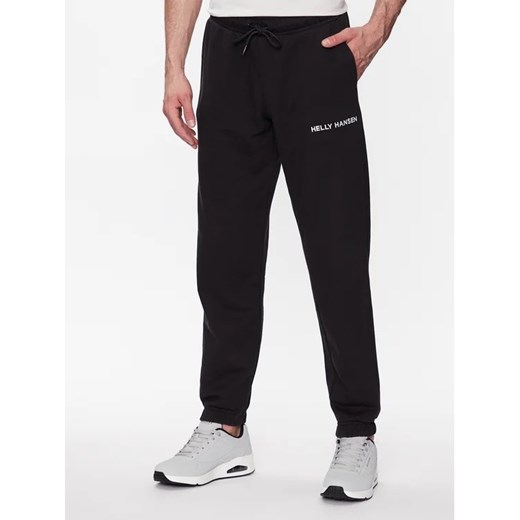 Helly Hansen Spodnie dresowe Core 53926 Czarny Regular Fit ze sklepu MODIVO w kategorii Spodnie męskie - zdjęcie 168438483