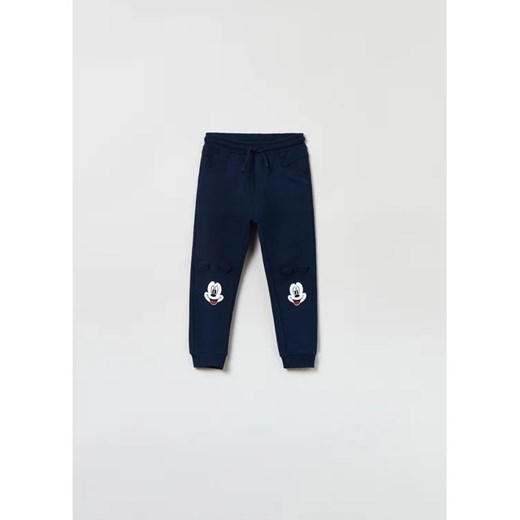OVS Spodnie dresowe DISNEY 1607642 Granatowy Regular Fit ze sklepu MODIVO w kategorii Spodnie chłopięce - zdjęcie 168456211