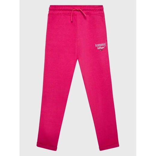 Tommy Hilfiger Spodnie dresowe Graphic KG0KG06866 D Różowy Regular Fit ze sklepu MODIVO w kategorii Spodnie dziewczęce - zdjęcie 168472684