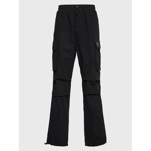 Karl Kani Spodnie materiałowe Rubber Signeture 6002520 Czarny Relaxed Fit ze sklepu MODIVO w kategorii Spodnie męskie - zdjęcie 168486273