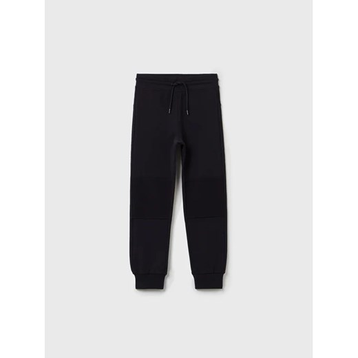 OVS Spodnie dresowe BATMAN 1333540 Czarny Regular Fit ze sklepu MODIVO w kategorii Spodnie chłopięce - zdjęcie 168493494