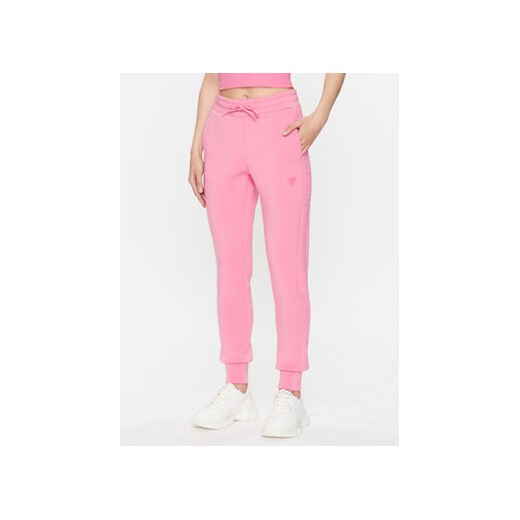 Guess Spodnie dresowe V2YB18 K7UW2 Różowy Reglan Fit ze sklepu MODIVO w kategorii Spodnie damskie - zdjęcie 168505571