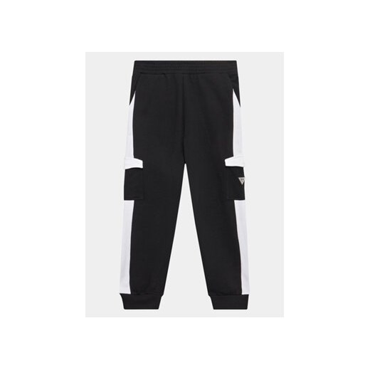 Guess Spodnie dresowe L3YQ12 KA6R3 Czarny Relaxed Fit ze sklepu MODIVO w kategorii Spodnie chłopięce - zdjęcie 168516800