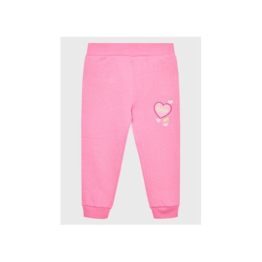 Guess Spodnie dresowe K2BQ16 KAX70 Różowy Regular Fit ze sklepu MODIVO w kategorii Spodnie i półśpiochy - zdjęcie 168520111