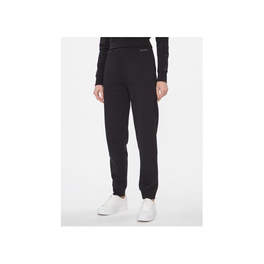 Calvin Klein Spodnie dresowe Metallic Micro Logo Jogger K20K206965 Czarny Regular Fit ze sklepu MODIVO w kategorii Spodnie damskie - zdjęcie 168526502