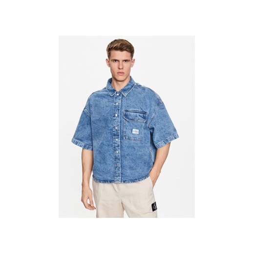 Calvin Klein Jeans Koszula jeansowa J30J322775 Niebieski Regular Fit ze sklepu MODIVO w kategorii Koszule męskie - zdjęcie 168535143
