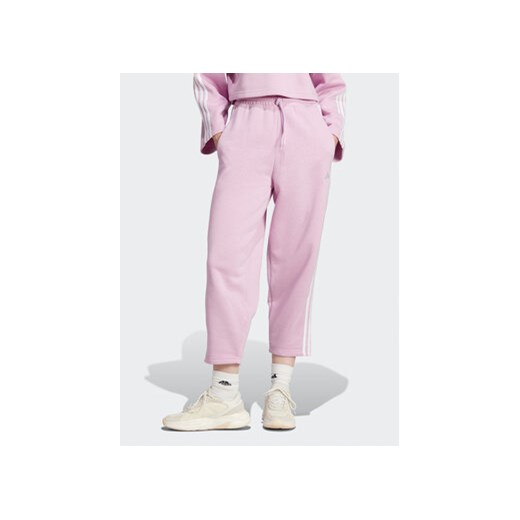 adidas Spodnie dresowe Essentials 3-Stripes Open Hem Fleece IJ7455 Różowy Loose Fit ze sklepu MODIVO w kategorii Spodnie damskie - zdjęcie 168547071