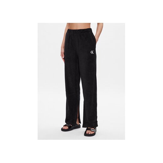 Calvin Klein Swimwear Spodnie dzianinowe KW0KW02094 Czarny Relaxed Fit ze sklepu MODIVO w kategorii Spodnie damskie - zdjęcie 168560323