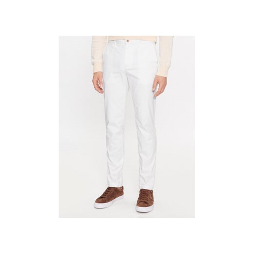 Tommy Hilfiger Chinosy Bleecker MW0MW26619 Biały Slim Fit ze sklepu MODIVO w kategorii Spodnie męskie - zdjęcie 168564850