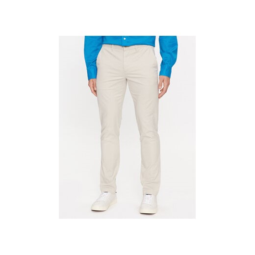 Tommy Hilfiger Chinosy Bleecker MW0MW26619 Beżowy Slim Fit ze sklepu MODIVO w kategorii Spodnie męskie - zdjęcie 168587193