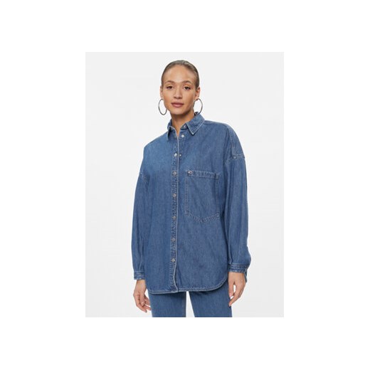 Tommy Jeans Koszula jeansowa DW0DW16422 Niebieski Relaxed Fit ze sklepu MODIVO w kategorii Koszule damskie - zdjęcie 168591410