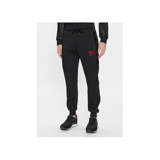 Guess Spodnie dresowe Gaston Z4RB00 KBO62 Czarny Regular Fit ze sklepu MODIVO w kategorii Spodnie męskie - zdjęcie 168596540