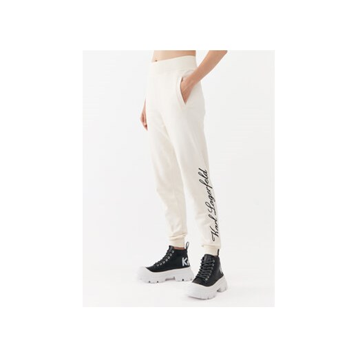 KARL LAGERFELD Spodnie dresowe 231W1050 Écru Regular Fit ze sklepu MODIVO w kategorii Spodnie damskie - zdjęcie 168622990