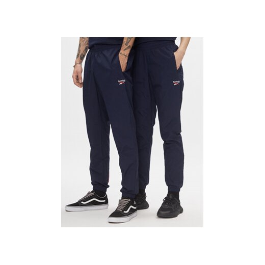 Reebok Spodnie dresowe Classics Vector Tracksuit Bottoms H54439 Niebieski Slim Fit ze sklepu MODIVO w kategorii Spodnie męskie - zdjęcie 168623383
