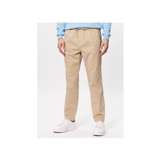 United Colors Of Benetton Spodnie materiałowe 4UN4UF01N Beżowy Slim Fit ze sklepu MODIVO w kategorii Spodnie męskie - zdjęcie 168634580