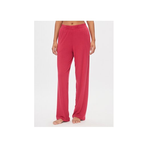 Calvin Klein Underwear Spodnie piżamowe 000QS7007E Czerwony Relaxed Fit ze sklepu MODIVO w kategorii Piżamy damskie - zdjęcie 168647532