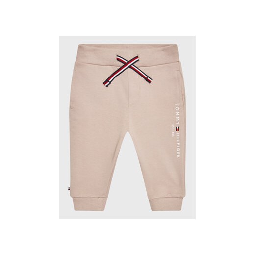 Tommy Hilfiger Spodnie dresowe Essential KN0KN01281 Beżowy Regular Fit ze sklepu MODIVO w kategorii Spodnie i półśpiochy - zdjęcie 168679842