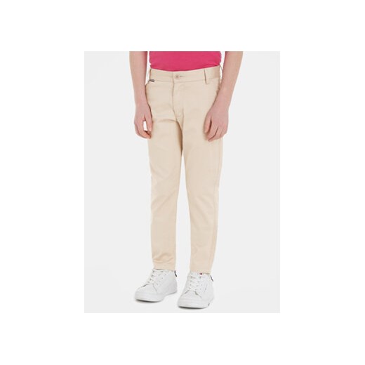 Tommy Hilfiger Spodnie materiałowe KB0KB08609 Beżowy Slim Fit ze sklepu MODIVO w kategorii Spodnie chłopięce - zdjęcie 168686751