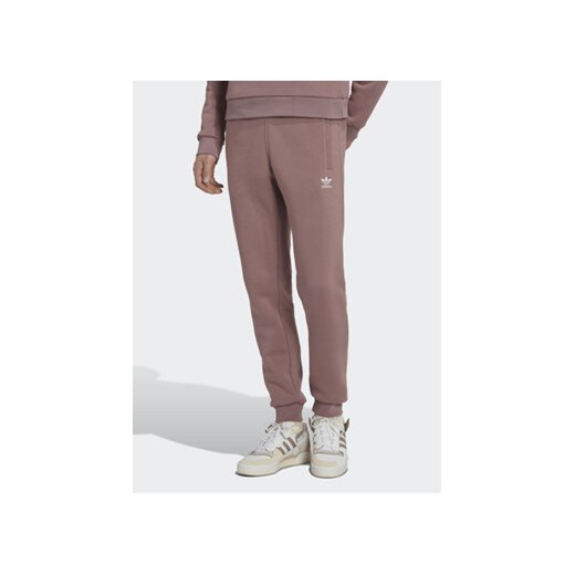 adidas Spodnie dresowe adicolor Essentials Trefoil HK0105 Różowy Slim Fit ze sklepu MODIVO w kategorii Spodnie damskie - zdjęcie 168787880