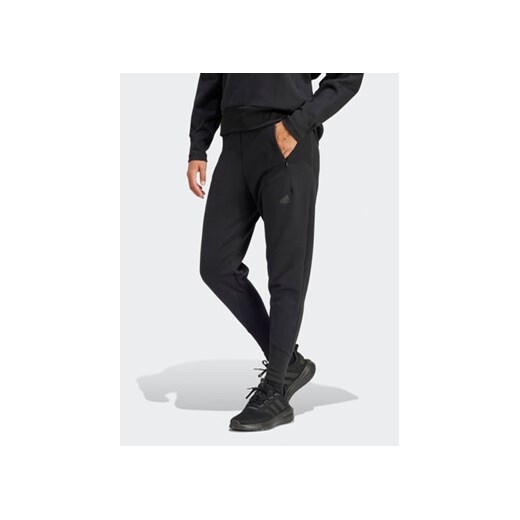 adidas Spodnie dresowe Z.N.E. Winterized IN9476 Czarny Regular Fit ze sklepu MODIVO w kategorii Spodnie damskie - zdjęcie 168838591