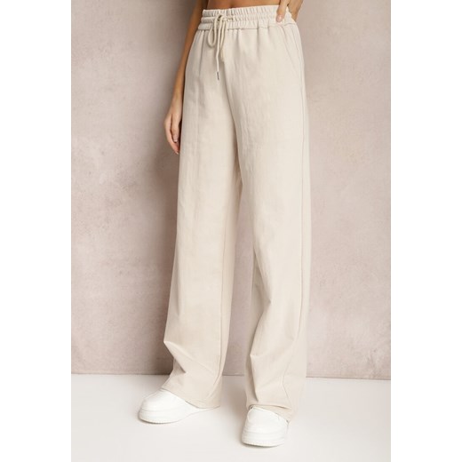 Jasnobeżowe Szerokie Spodnie Dresowe z Elastycznej Bawełny Niarti ze sklepu Renee odzież w kategorii Spodnie damskie - zdjęcie 168988403
