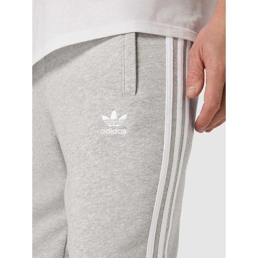 Szare spodnie męskie Adidas Originals bawełniane 