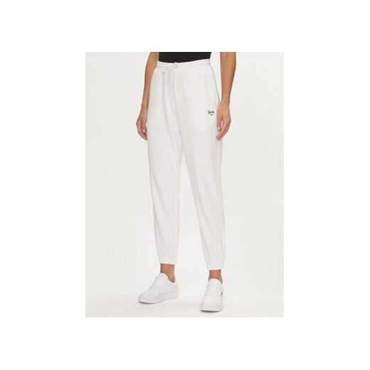 Tommy Jeans Spodnie dresowe Script DW0DW17771 Biały Relaxed Fit ze sklepu MODIVO w kategorii Spodnie damskie - zdjęcie 169015793